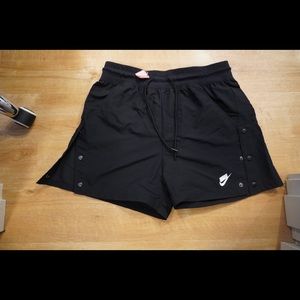 Nike Black Shorts. Breakaway buttons on side.